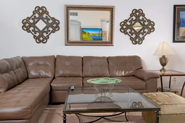 a living room with furniture and a rug