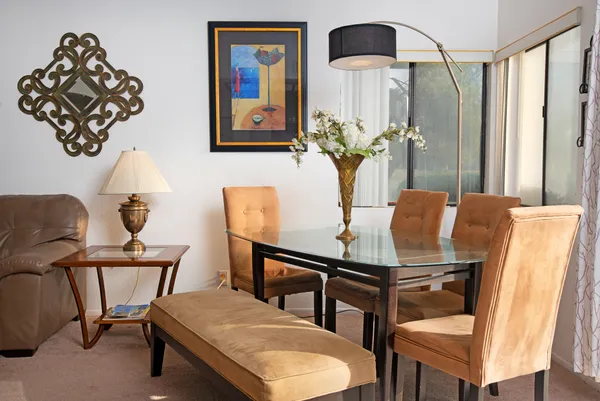 a dining room with furniture and window