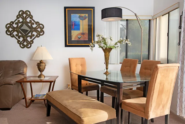 a dining room with furniture and window