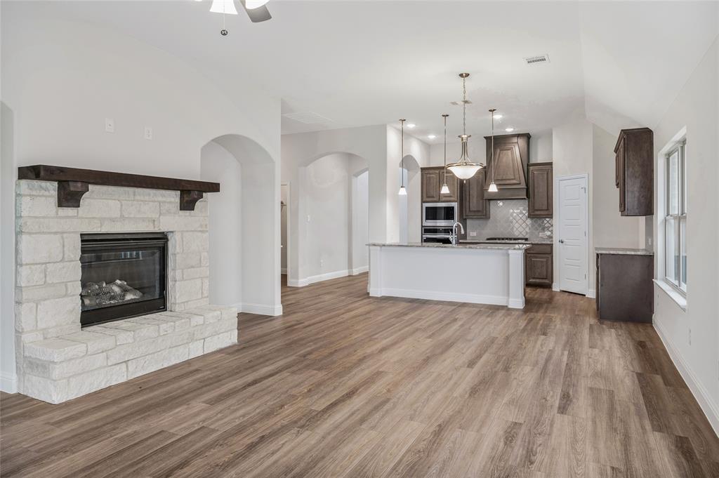 14566 Helena Street Pilot Point, TX 76258 - Photo 15 of 37 a view of a kitchen with cabinets and wooden floor