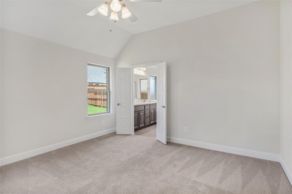 14566 Helena Street Pilot Point, TX 76258 - Photo 17 of 37 an empty room with windows and entrance