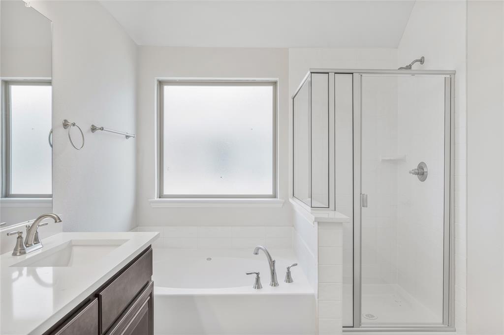 14566 Helena Street Pilot Point, TX 76258 - Photo 30 of 37 a bathroom with a granite countertop sink a toilet and shower
