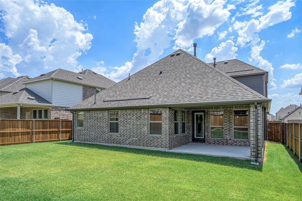 14566 Helena Street Pilot Point, TX 76258 - Photo 33 of 37 a view of a house with a garden