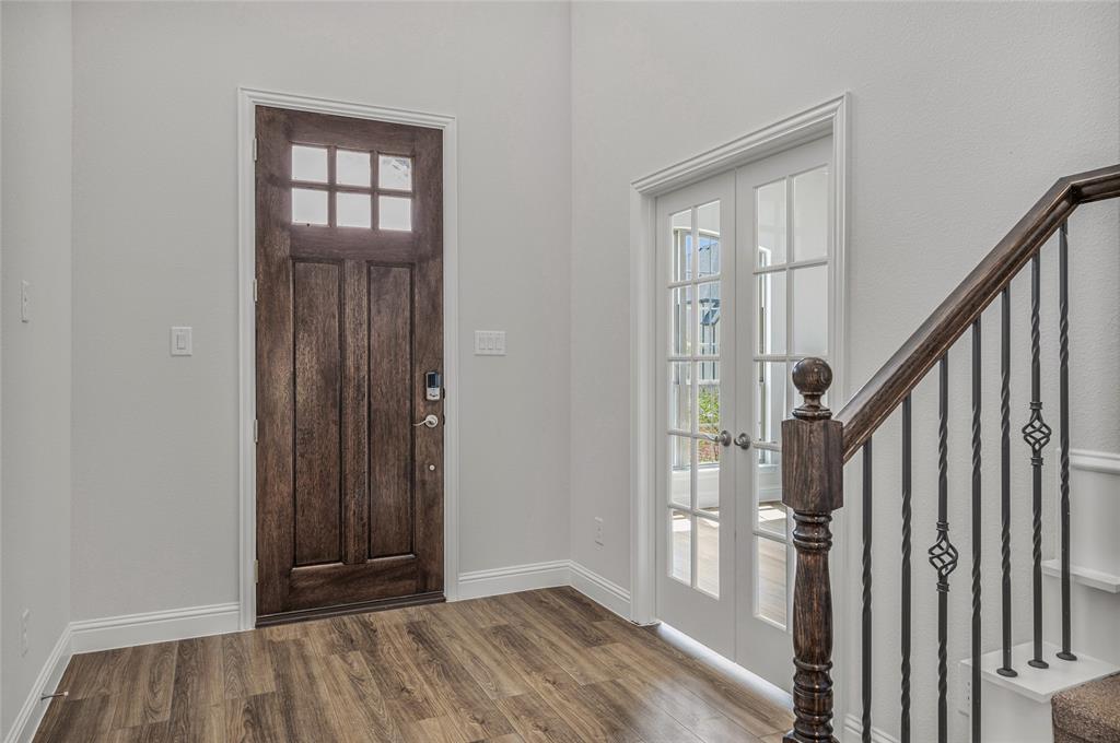 14566 Helena Street Pilot Point, TX 76258 - Photo 5 of 37 wooden floor and windows in an empty room