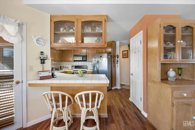 a dining table chair next to a window