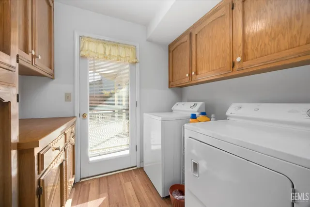 a view of storage and utility room with washer and dryer