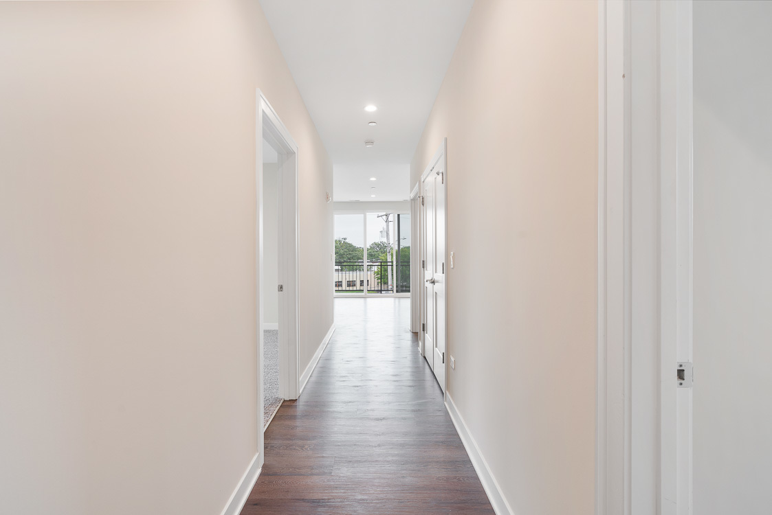 546 Green Bay Road, Unit 410 Highwood, IL 60040 - Photo 5 of 15 a view of a hallway with wooden floor