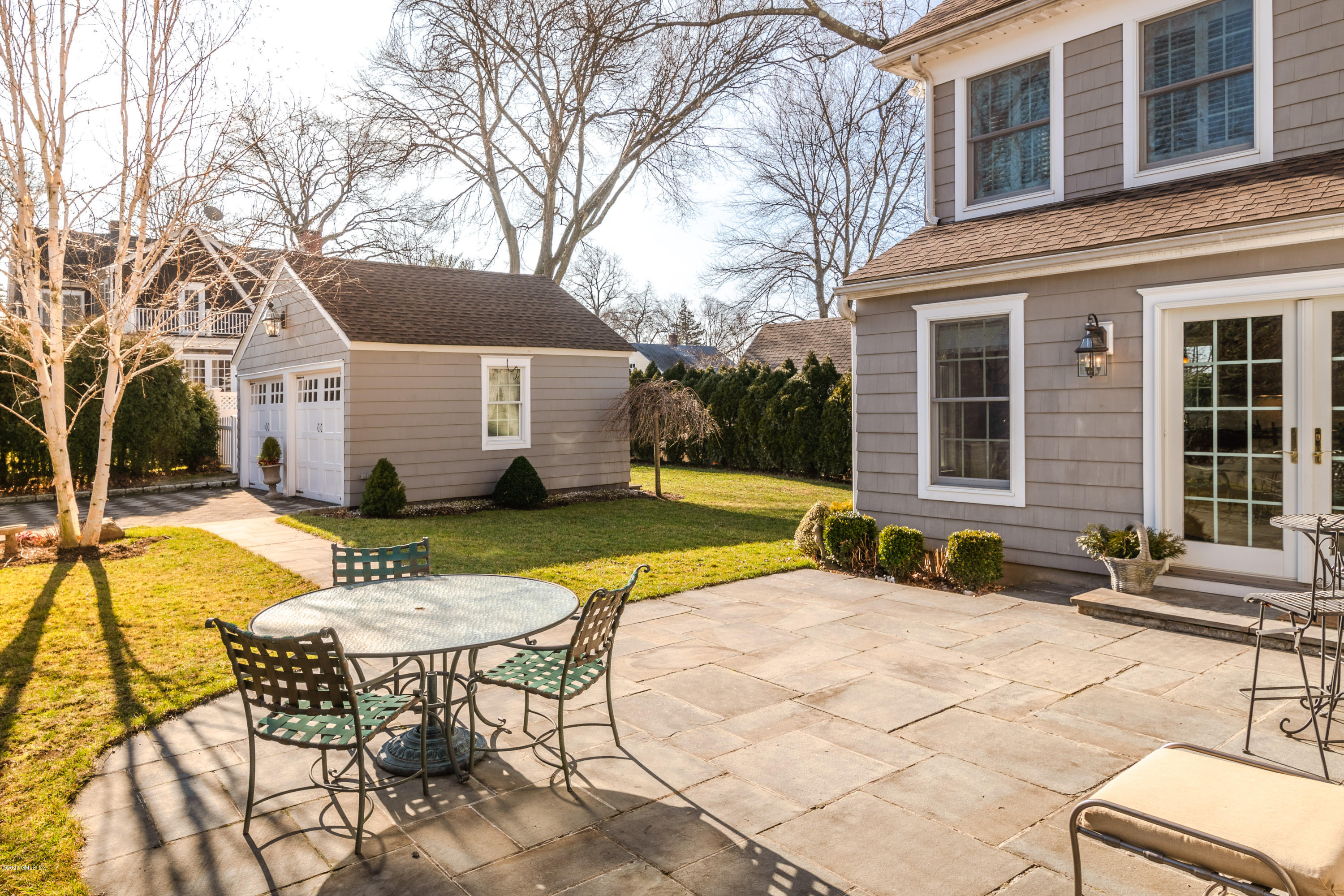 18 Stuart Drive Old Greenwich, CT 06870 - Photo 19 of 25 a view of a house with swimming pool and sitting area