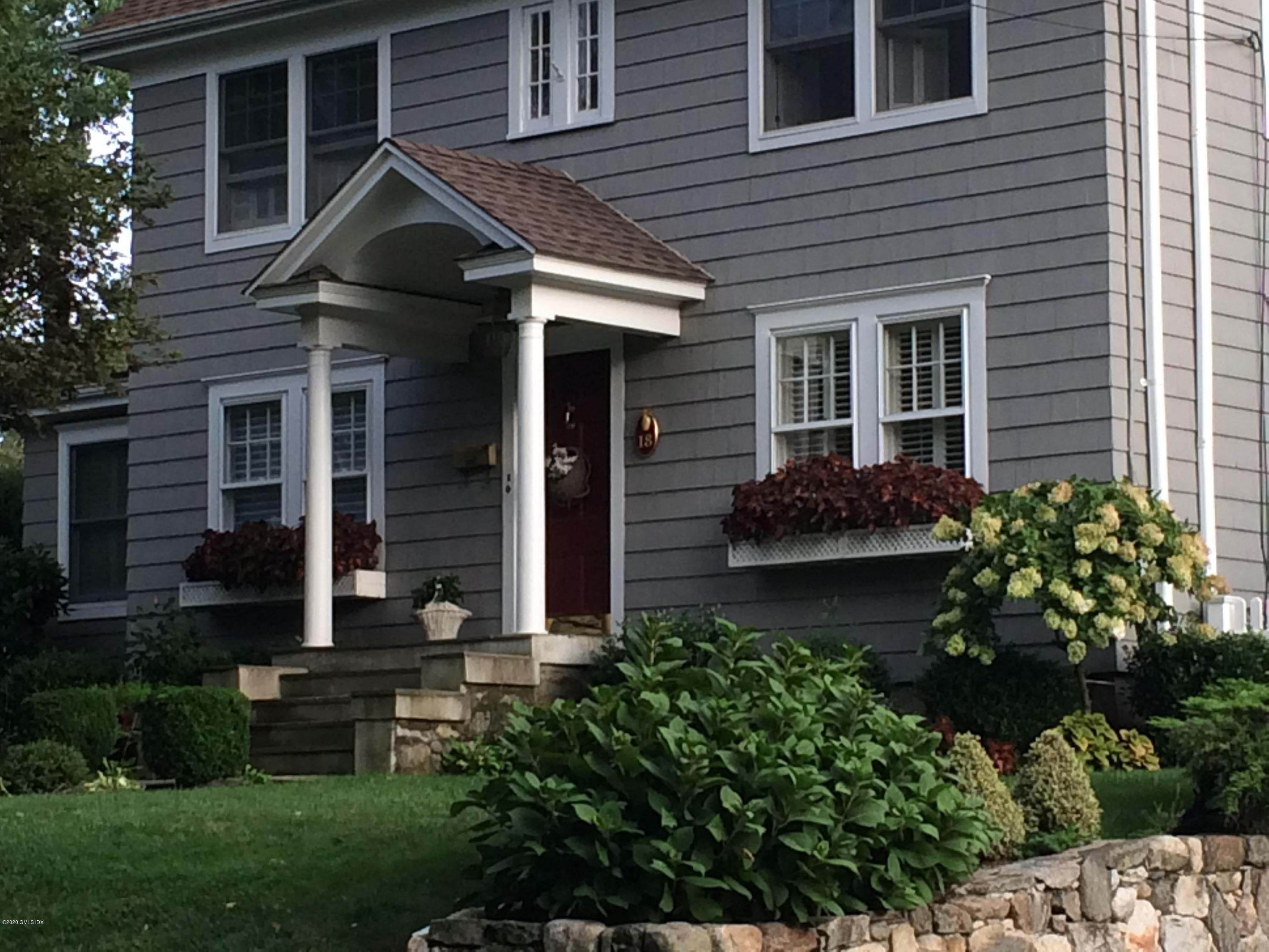 18 Stuart Drive Old Greenwich, CT 06870 - Photo 24 of 25 a front view of a house with garden