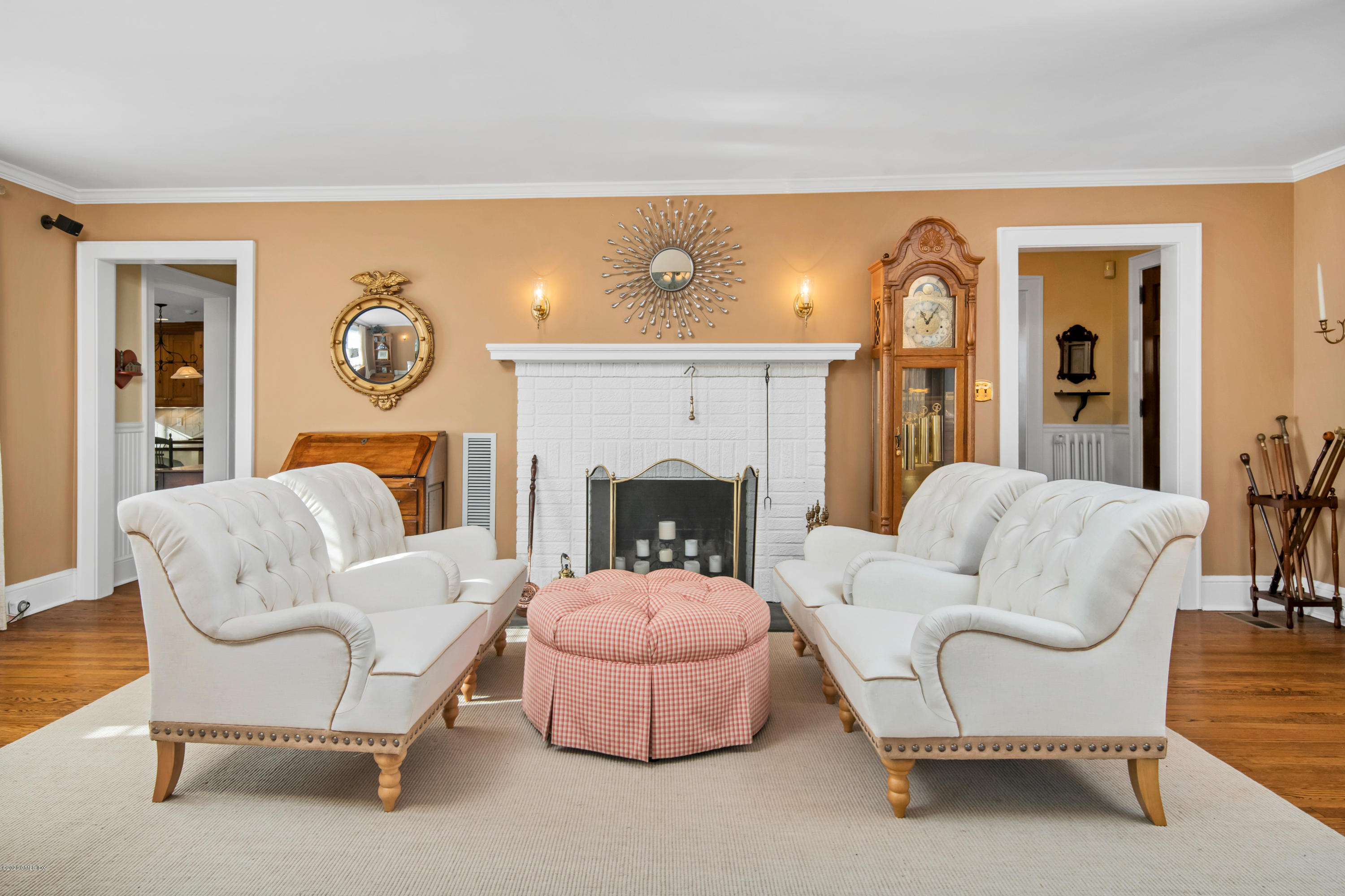 18 Stuart Drive Old Greenwich, CT 06870 - Photo 3 of 25 a living room with furniture and a fireplace