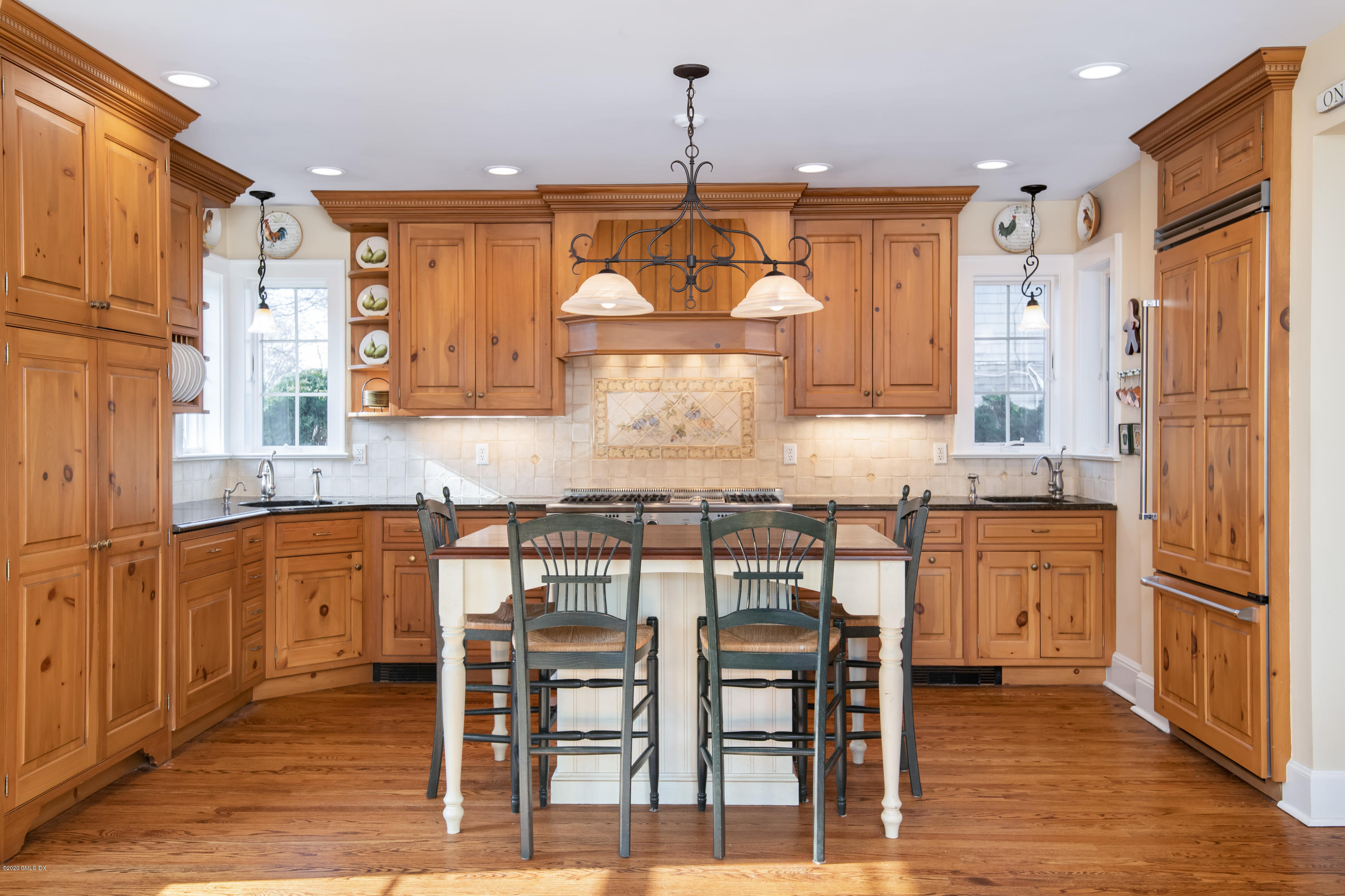 18 Stuart Drive Old Greenwich, CT 06870 - Photo 5 of 25 a kitchen with granite countertop wooden cabinets and white appliances