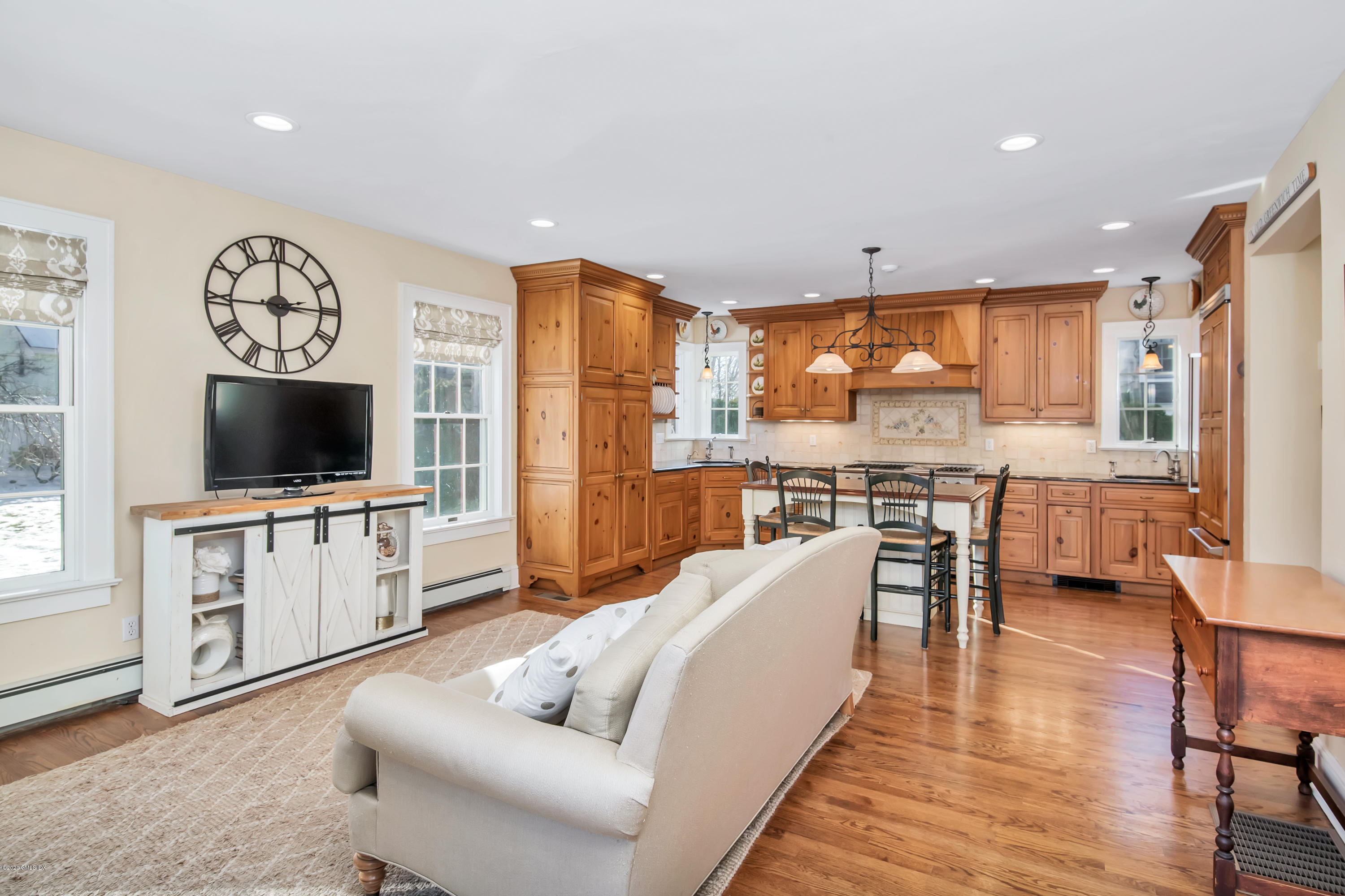 18 Stuart Drive Old Greenwich, CT 06870 - Photo 7 of 25 a living room with furniture and a flat screen tv