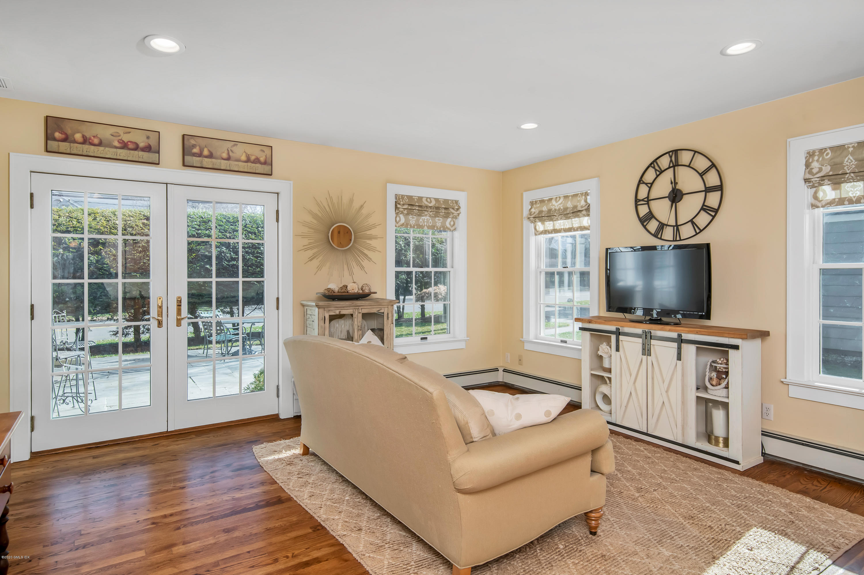 18 Stuart Drive Old Greenwich, CT 06870 - Photo 8 of 25 a living room with furniture and a flat screen tv