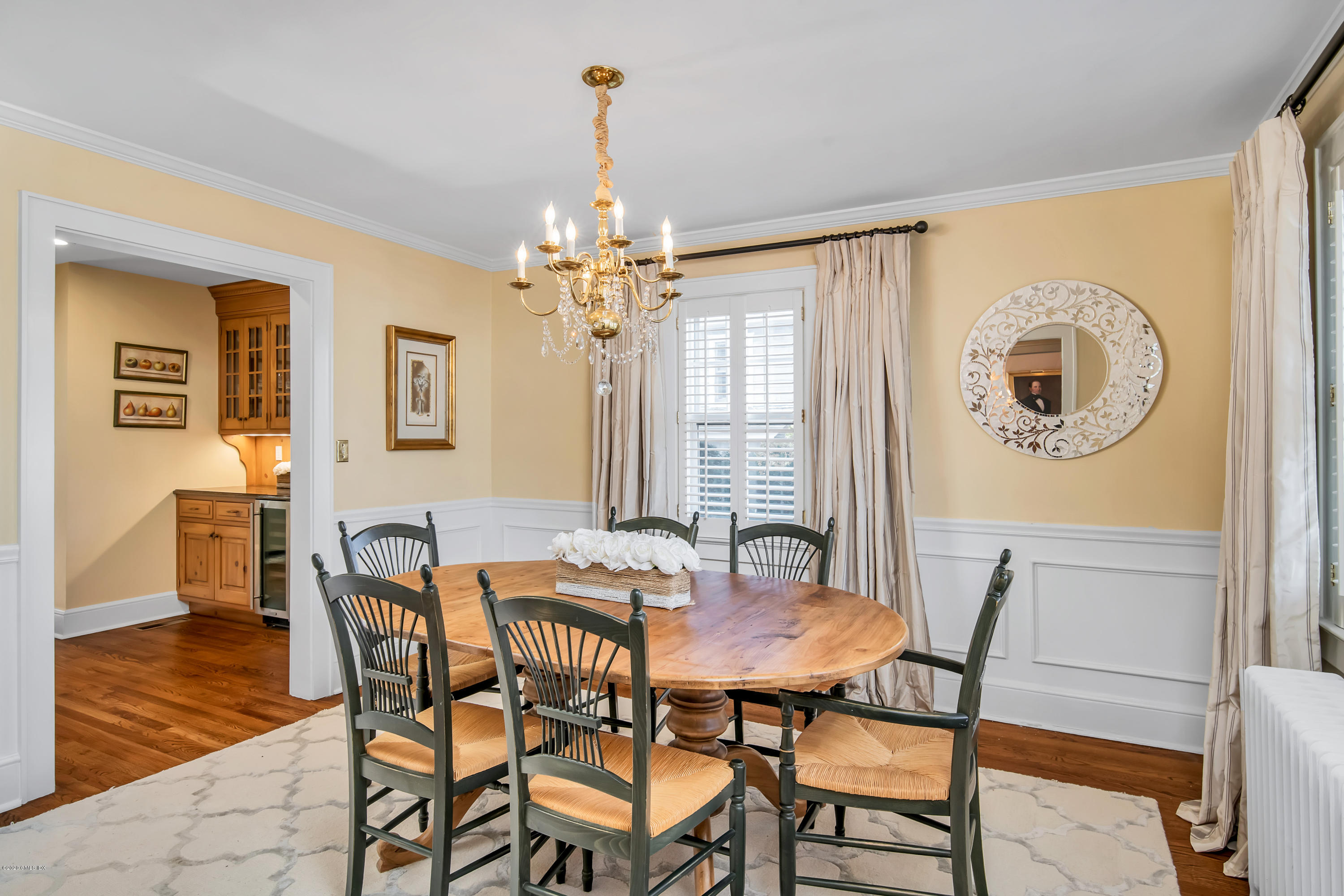 18 Stuart Drive Old Greenwich, CT 06870 - Photo 9 of 25 a view of a dining room with furniture and chandelier