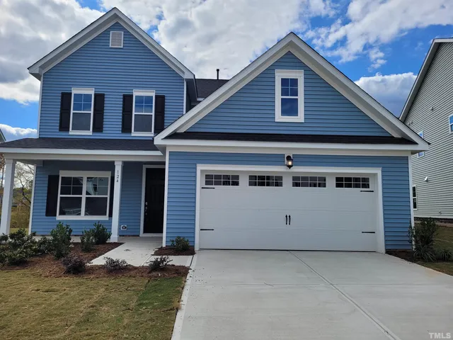 a view of house with yard