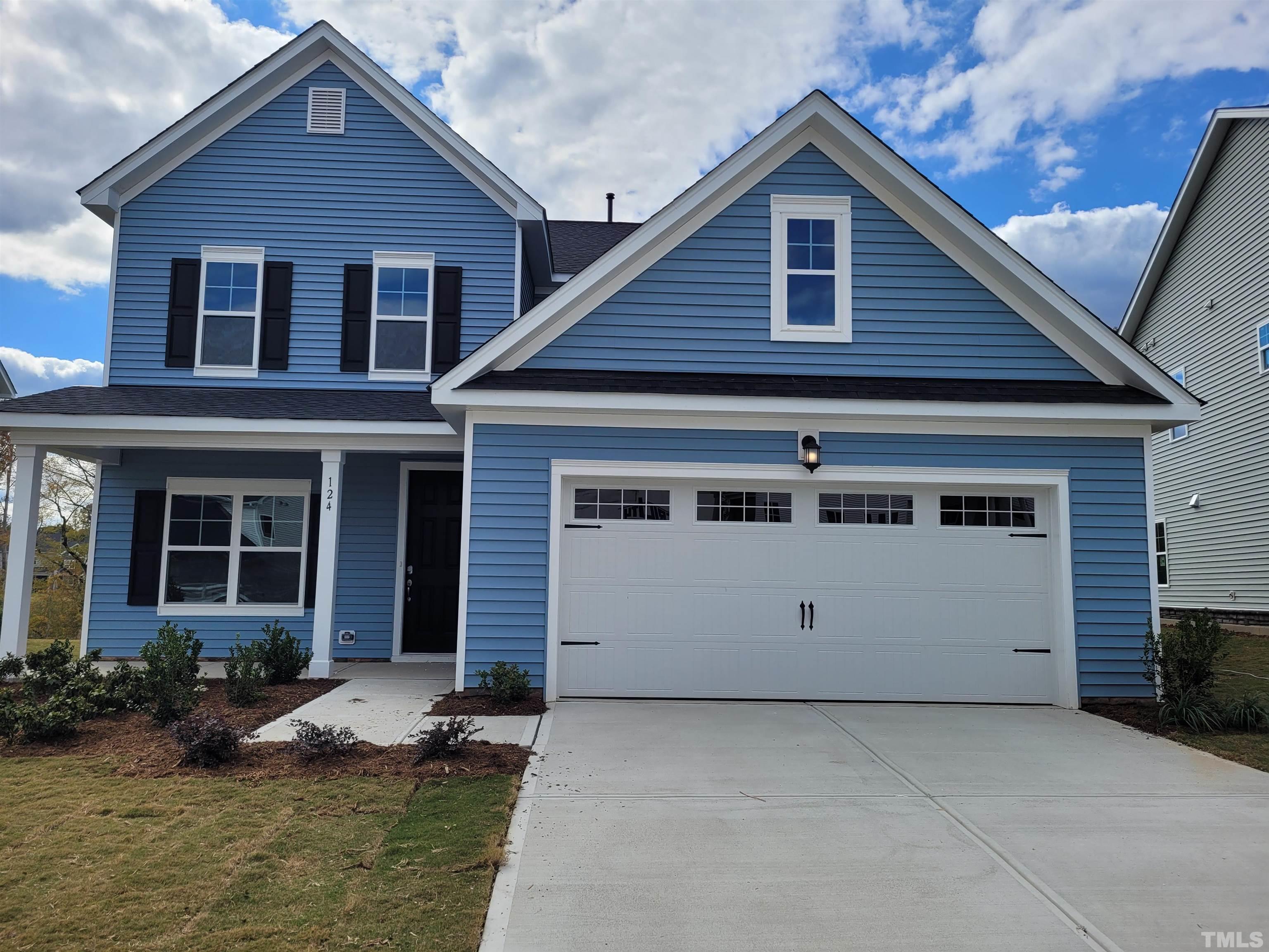 124 Trailing Bluff Way Garner, NC 27529 - Photo 1 of 21 a view of house with yard
