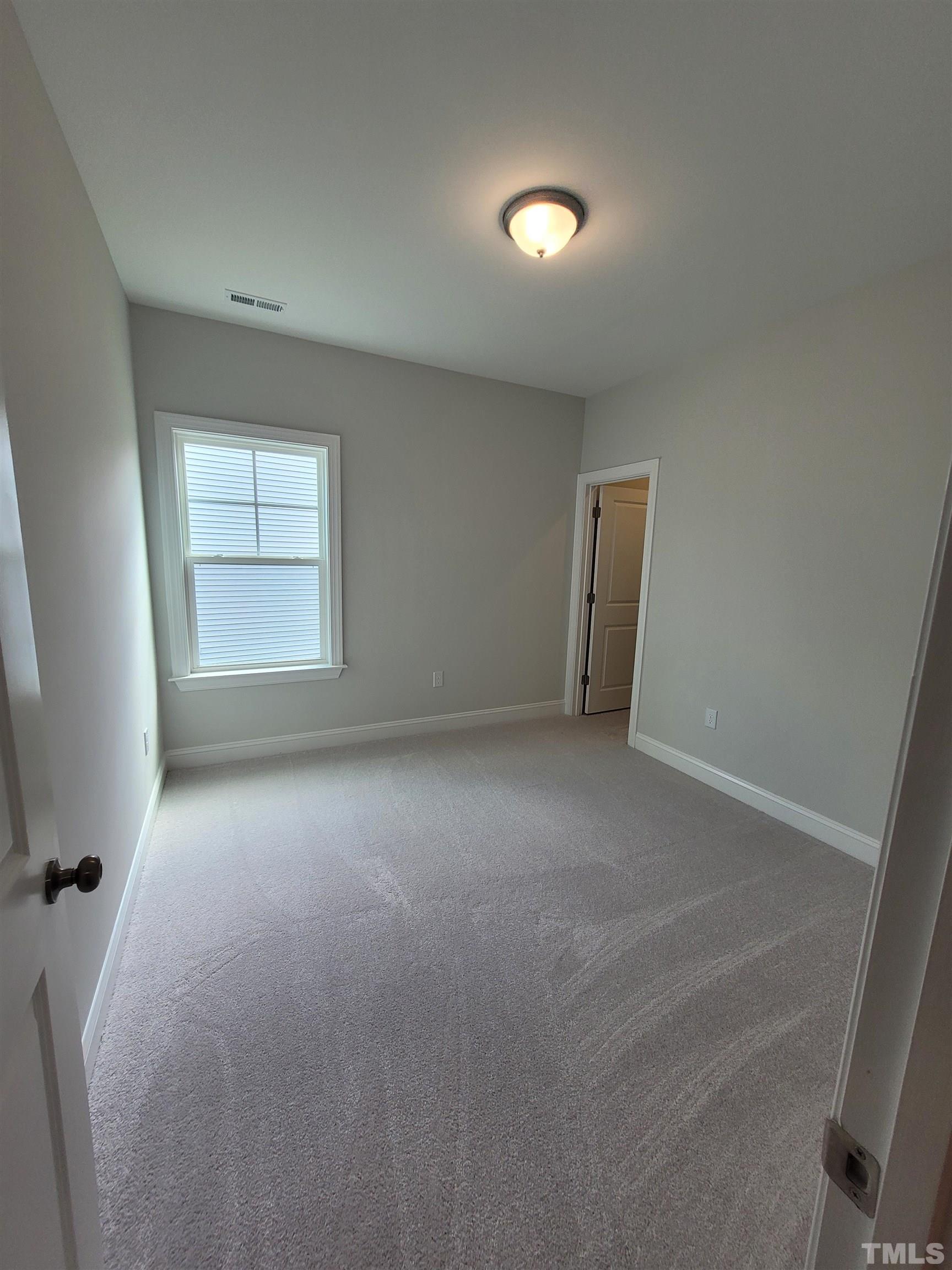 124 Trailing Bluff Way Garner, NC 27529 - Photo 15 of 21 an empty room with a window