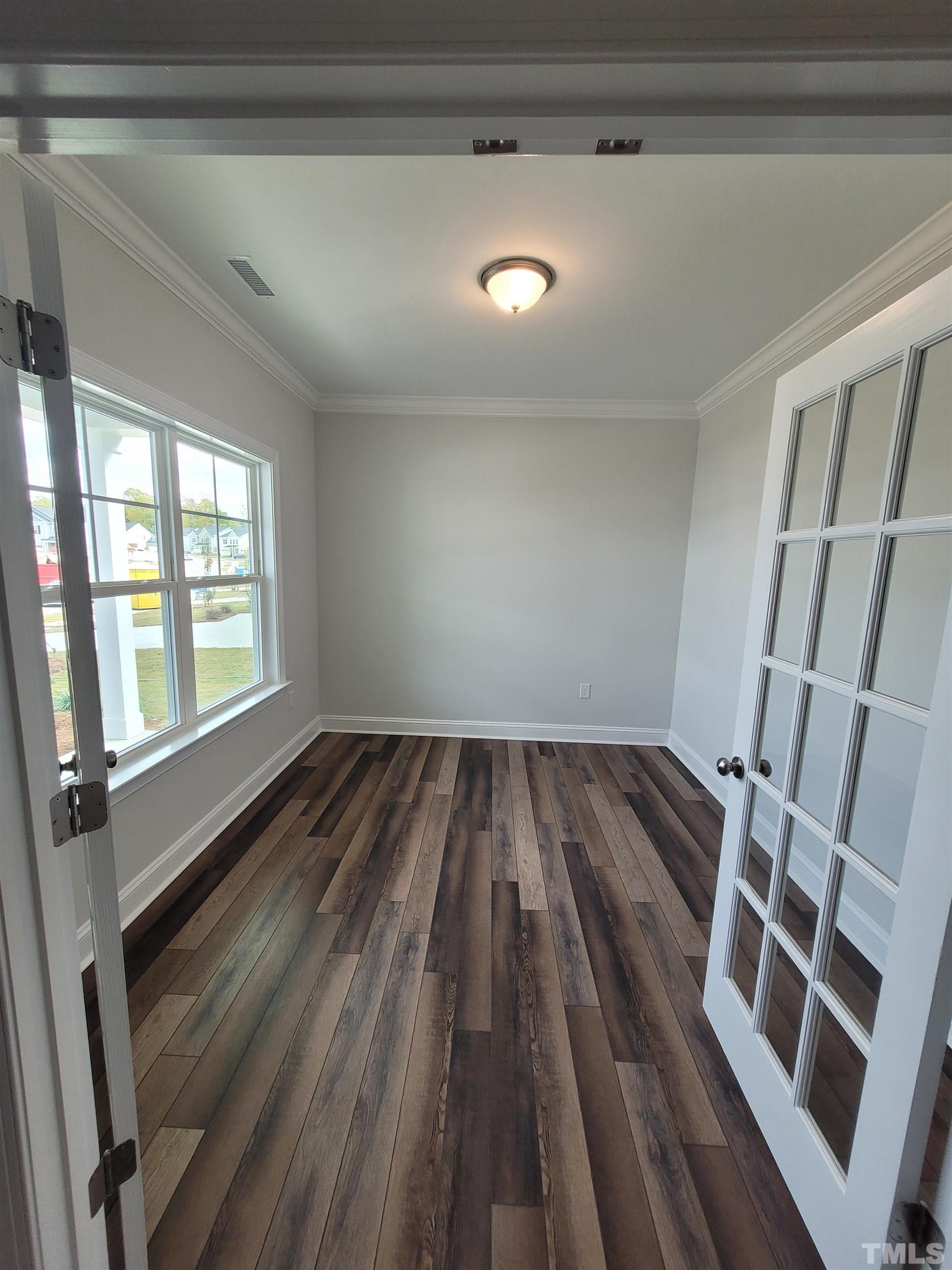 124 Trailing Bluff Way Garner, NC 27529 - Photo 3 of 21 a view of a room with wooden floor and staircase