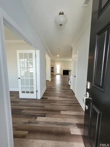 a view of an entryway with wooden floor