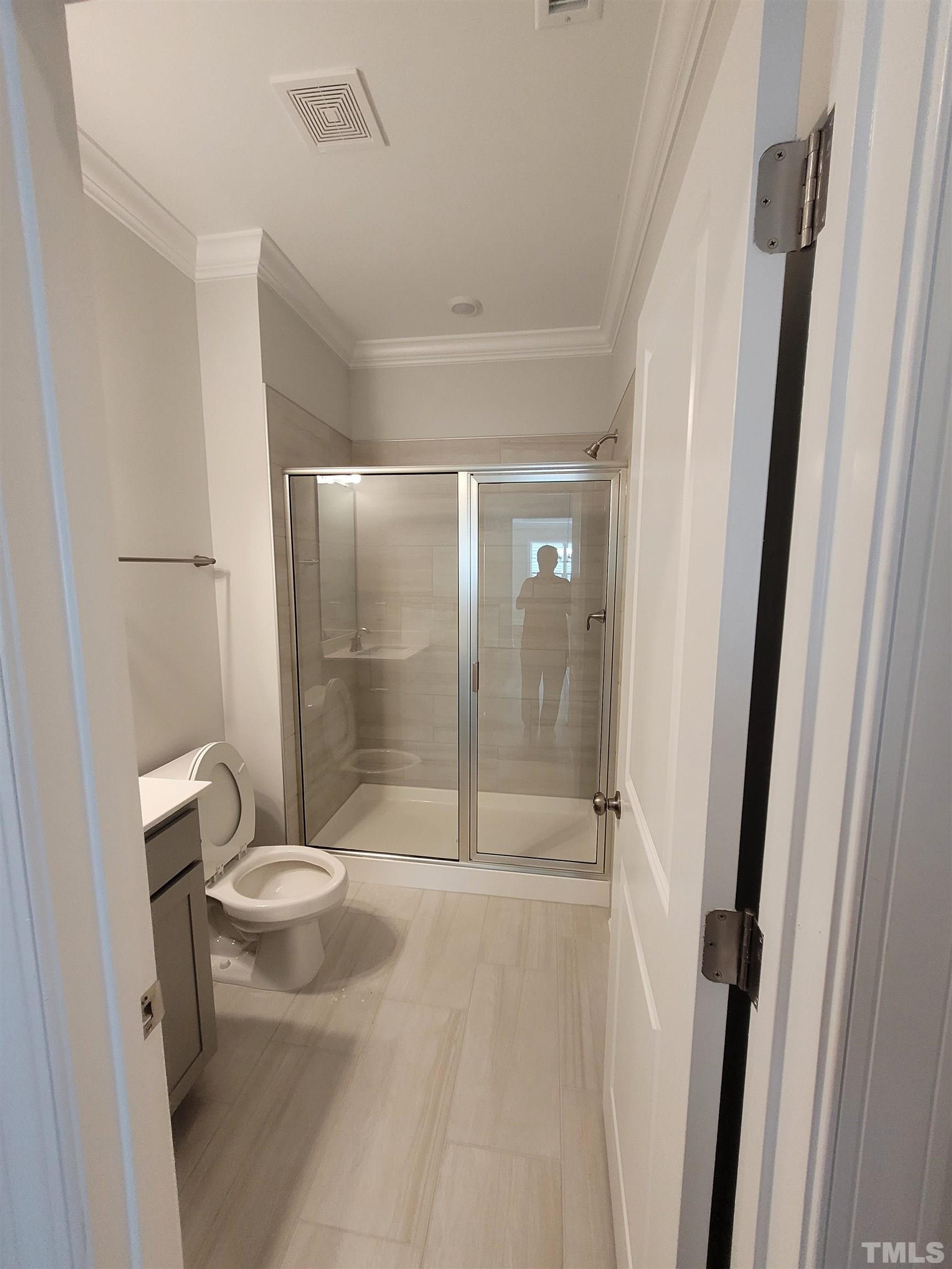 124 Trailing Bluff Way Garner, NC 27529 - Photo 8 of 21 a bathroom with a shower and toilet