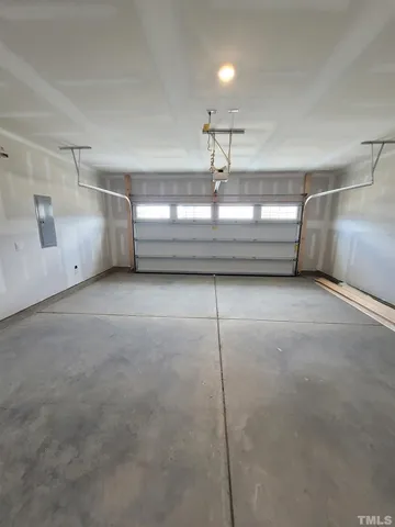 a view of a room with water heater and wooden floor
