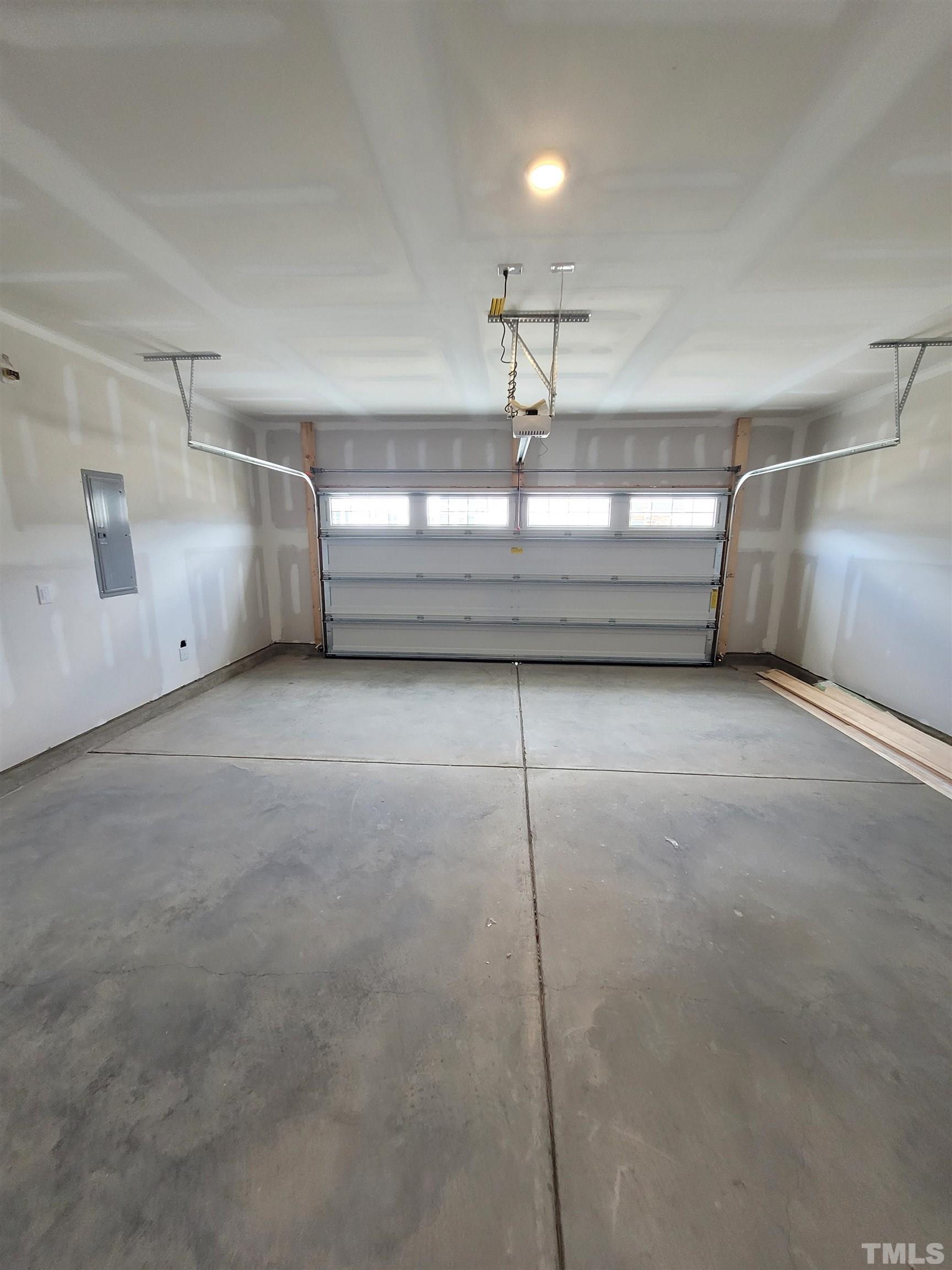 124 Trailing Bluff Way Garner, NC 27529 - Photo 10 of 21 a view of a room with water heater and wooden floor