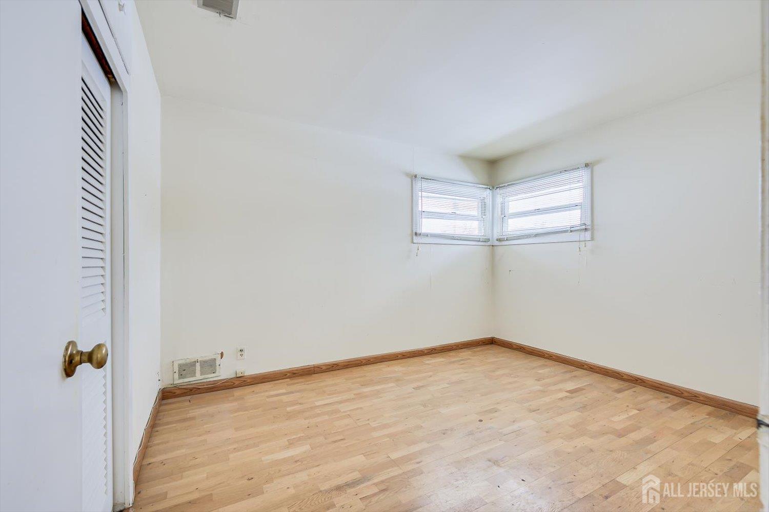 27 Stiles Road Edison, NJ 08817 - Photo 14 of 20 an empty room with windows and closet
