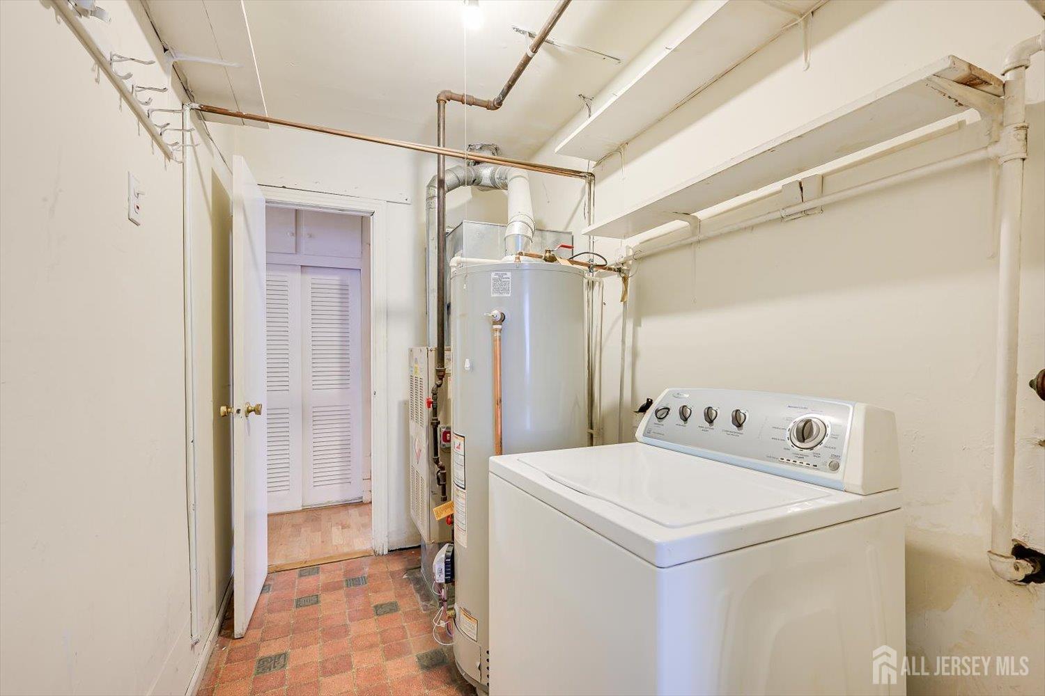 27 Stiles Road Edison, NJ 08817 - Photo 18 of 20 a utility room with dryer and washer