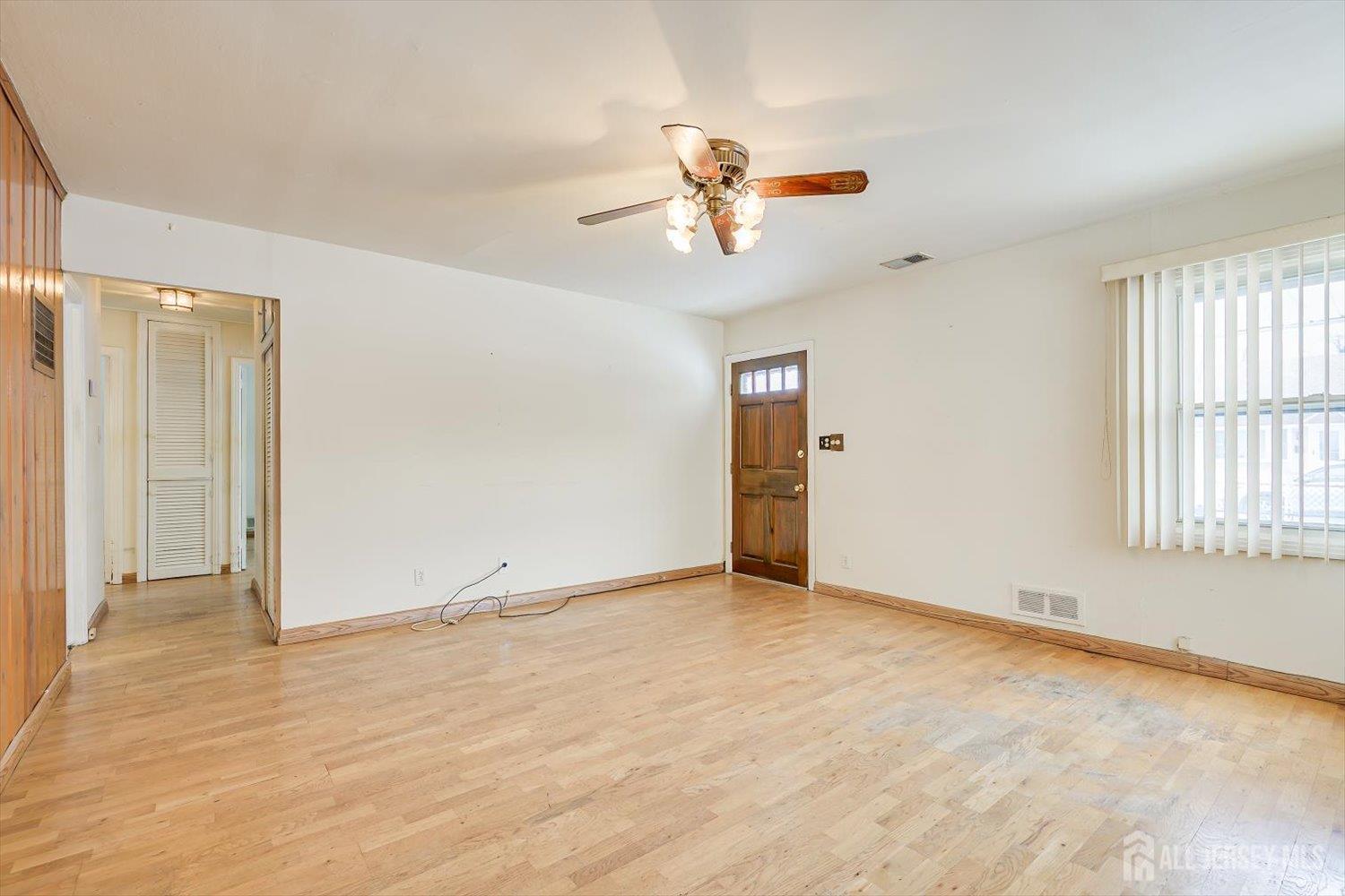 27 Stiles Road Edison, NJ 08817 - Photo 6 of 20 a view of an empty room with a window
