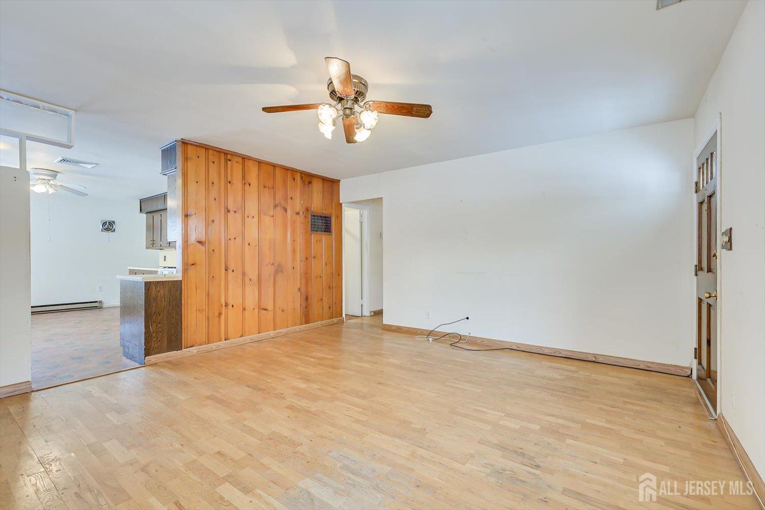 27 Stiles Road Edison, NJ 08817 - Photo 7 of 20 a view of a livingroom with a chandelier fan