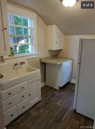 a room with cabinets and a wooden floor