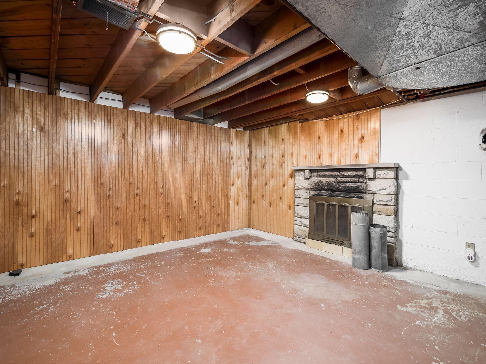 7710 Riverside Drive Dublin, OH 43016 - Photo 37 of 67 Non-functioning fireplace in basement