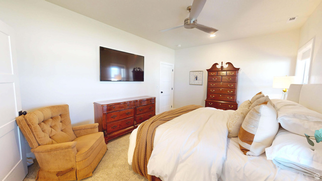 1127 4240 North Enoch, UT 84721 - Photo 20 of 56 Master Bedroom featuring ceiling fan and light colored carpet