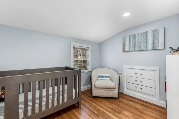 a spacious bedroom with a large bed and a window