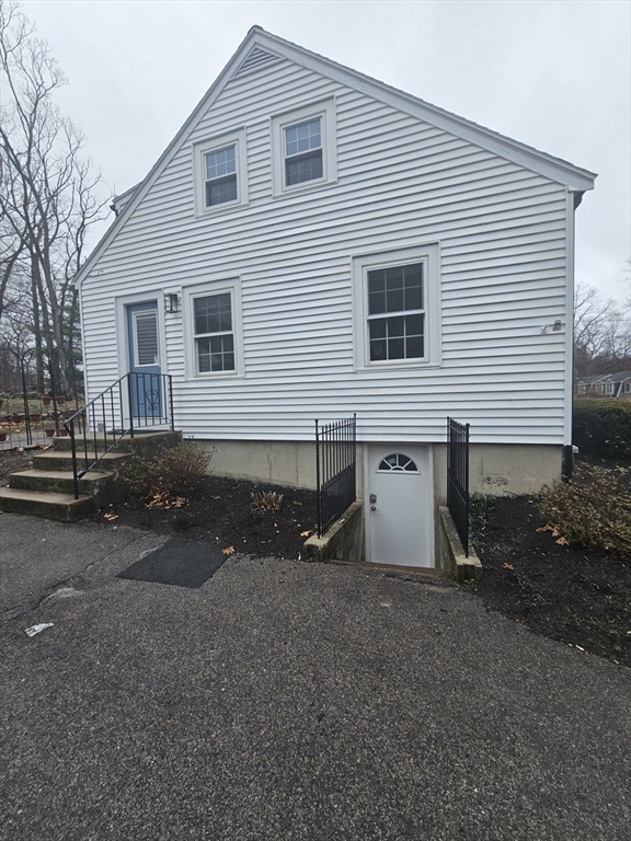 61 Ledgewood Road Dedham, MA 02026 - Photo 19 of 23 a view of a house with a yard