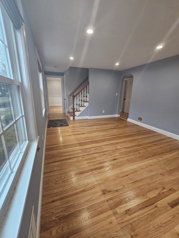 61 Ledgewood Road Dedham, MA 02026 - Photo 6 of 23 a view of an empty room with wooden floor