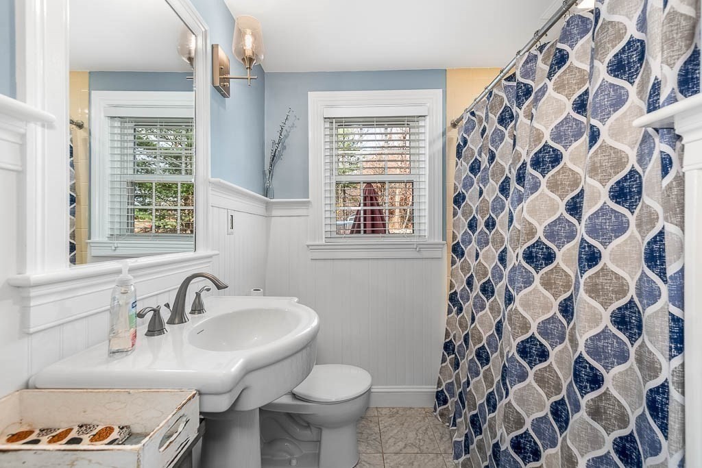 61 Ledgewood Road Dedham, MA 02026 - Photo 7 of 23 a bathroom with a sink and a toilet