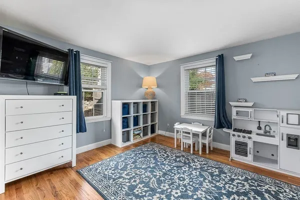 a living room with furniture and flat screen tv