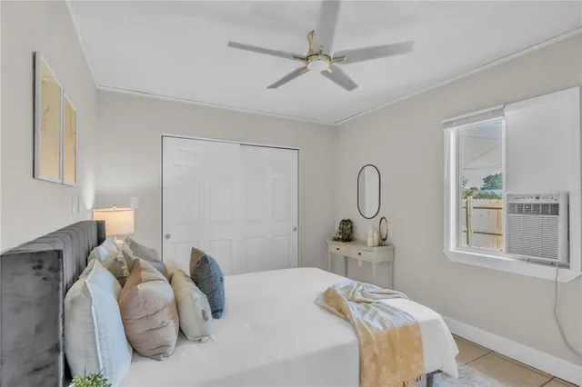 a bedroom with a bed and a chair