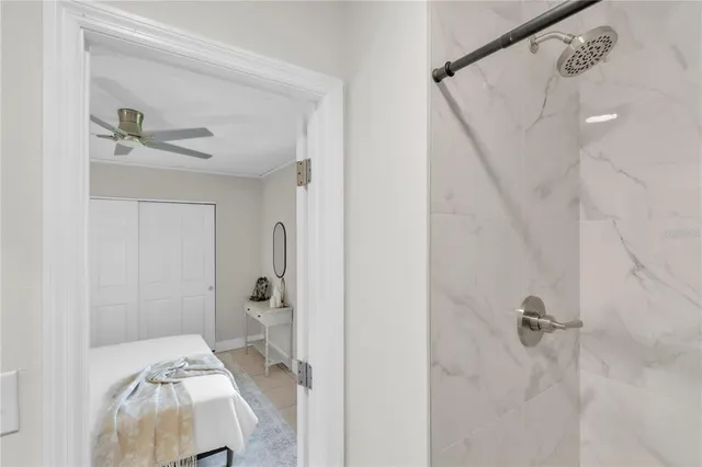 a bathroom with a bathtub and a shower