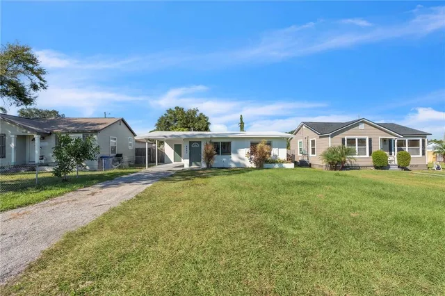 a front view of a house with a yard and porch