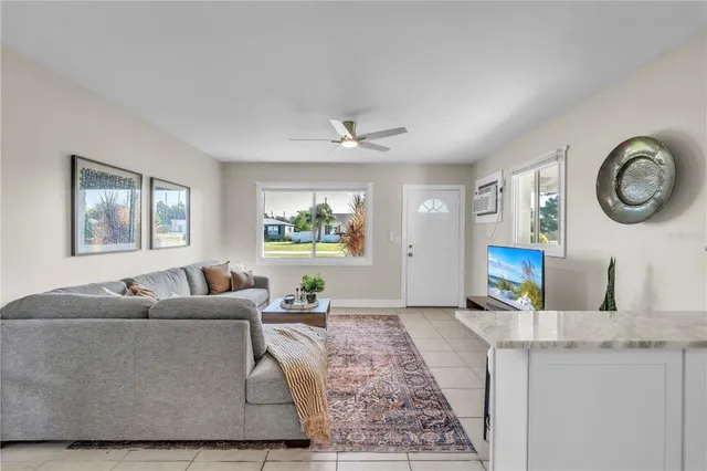 a living room with furniture and a window