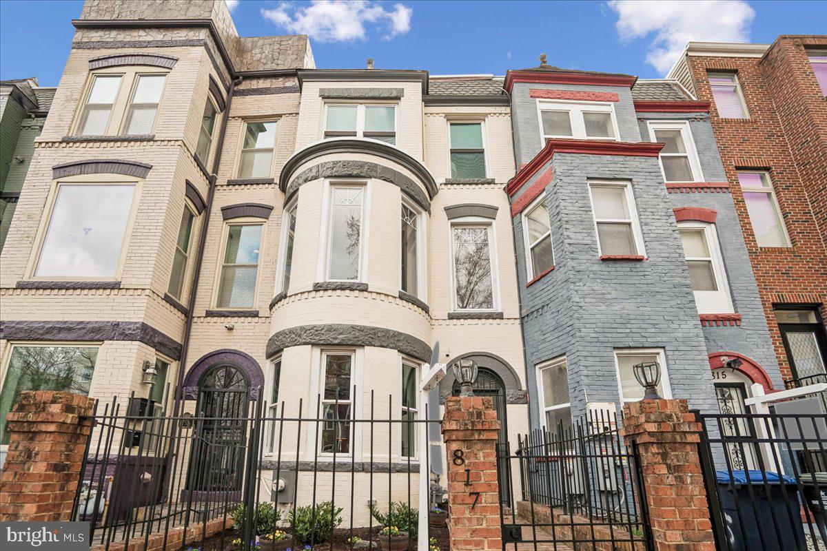 a front view of a residential apartment building with a balcony