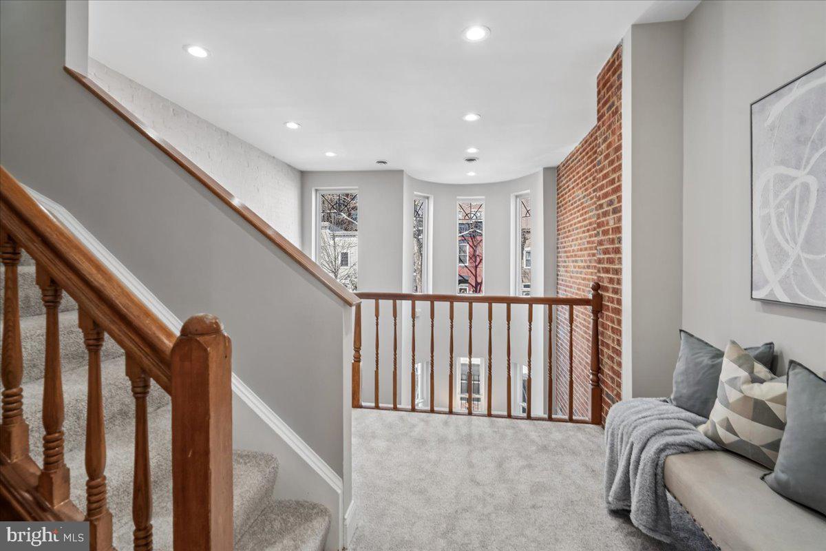 817 4th Street Northeast Washington, DC 20002 - Photo 17 of 40 a view of a hallway with furniture and stairs