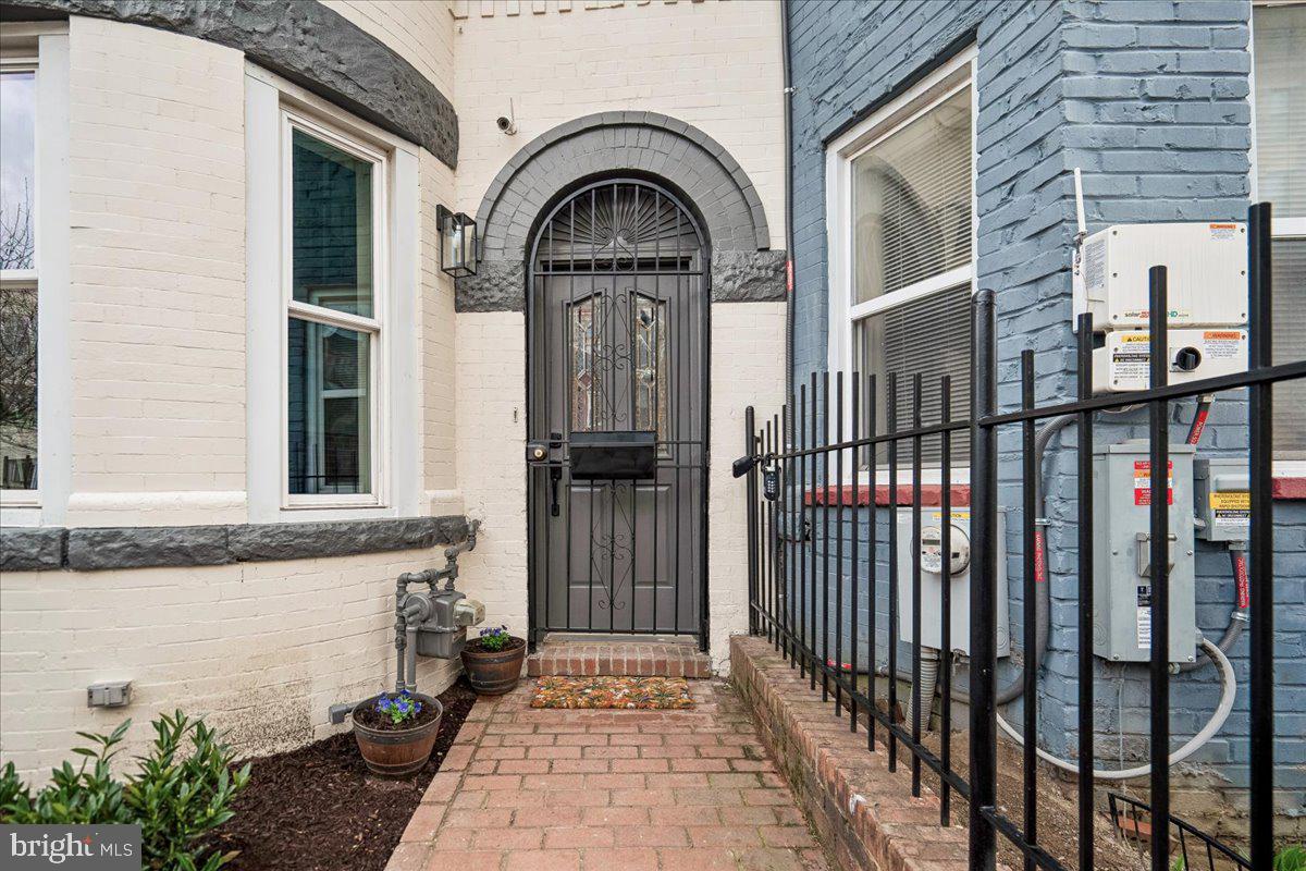 817 4th Street Northeast Washington, DC 20002 - Photo 2 of 40 a view of a brick house with a large windows