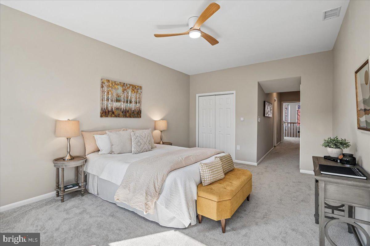 817 4th Street Northeast Washington, DC 20002 - Photo 21 of 40 a bedroom with a bed couch and a potted plant