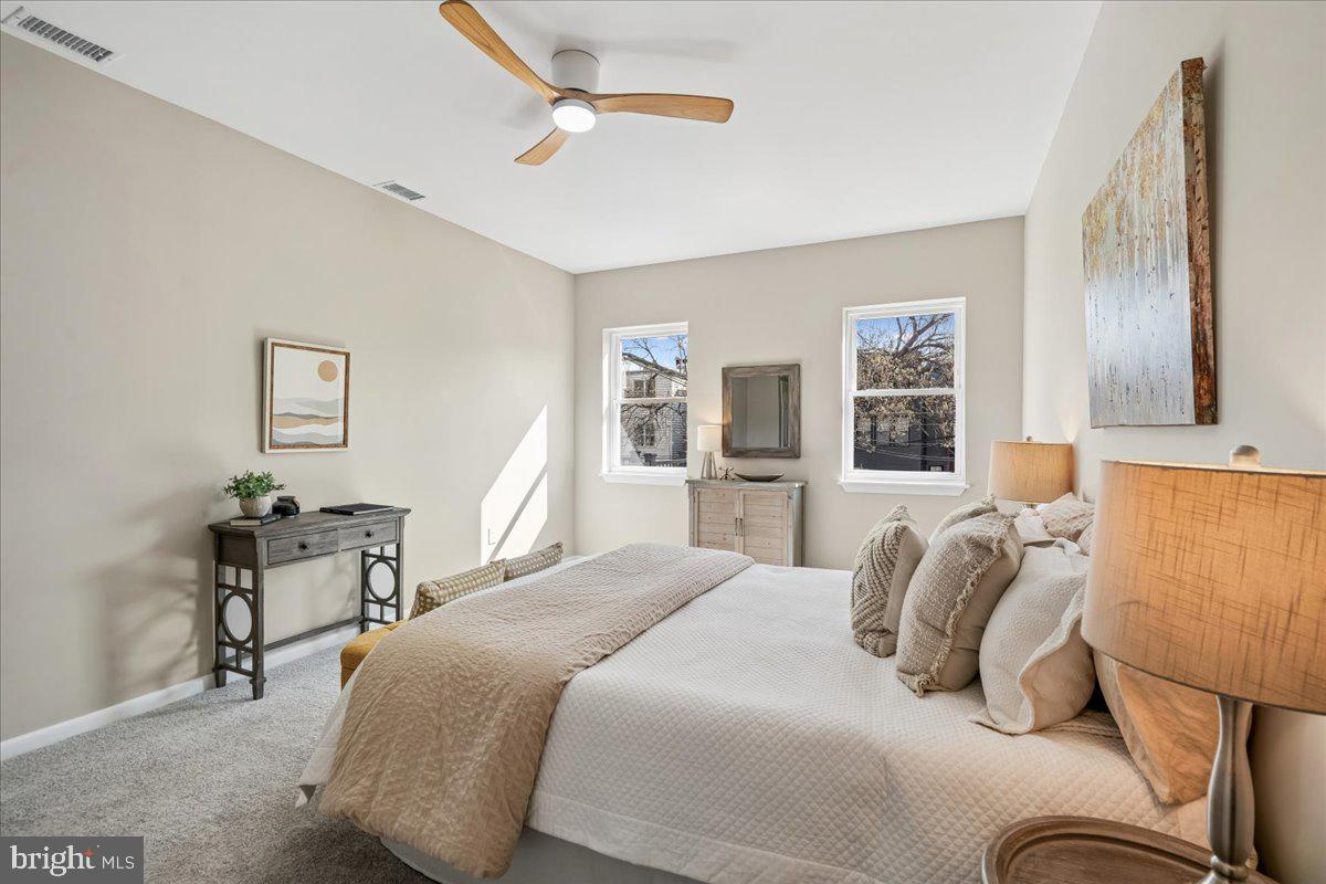 817 4th Street Northeast Washington, DC 20002 - Photo 22 of 40 a bedroom with a bed and wooden floor