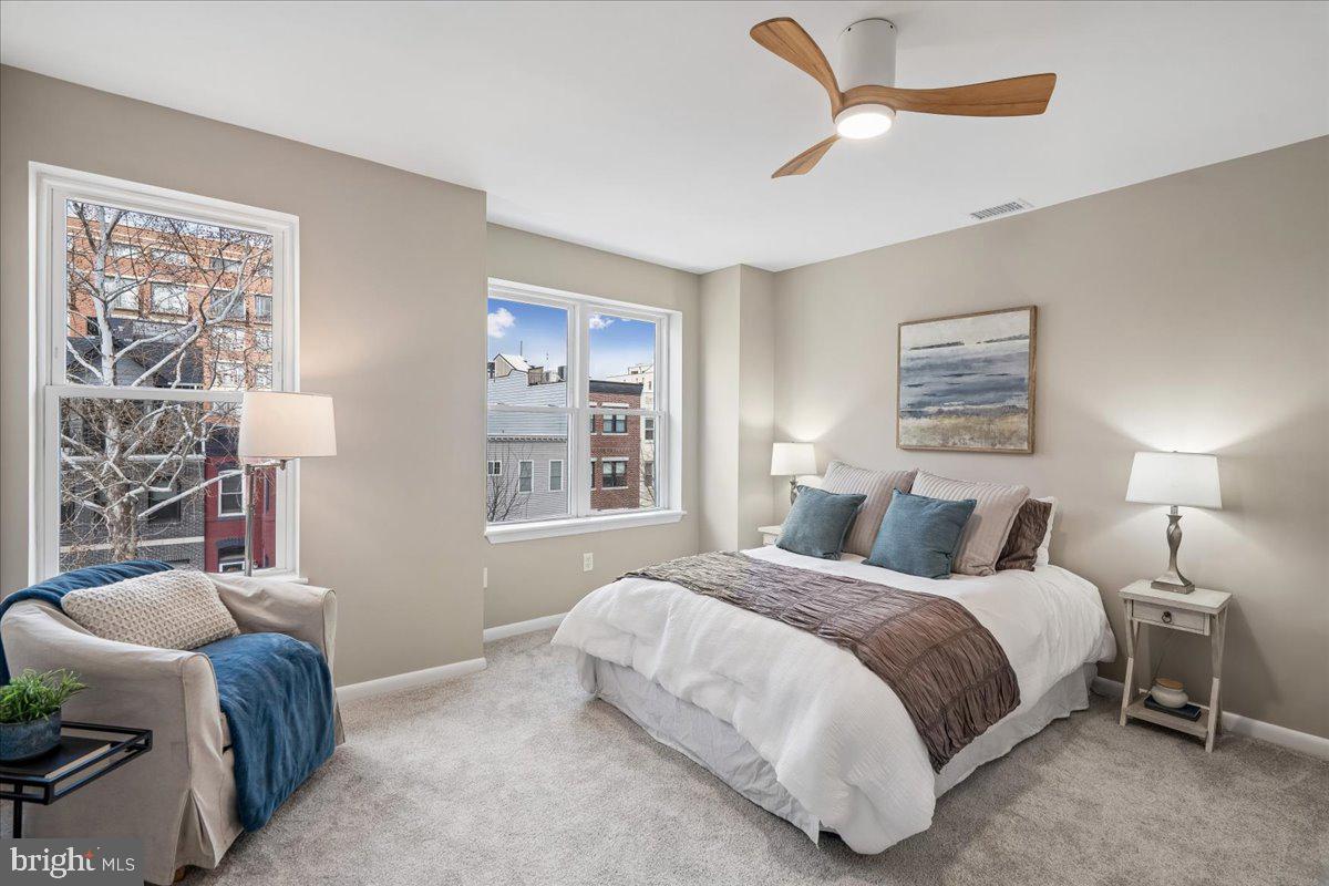 817 4th Street Northeast Washington, DC 20002 - Photo 26 of 40 a bedroom with a bed and a chair