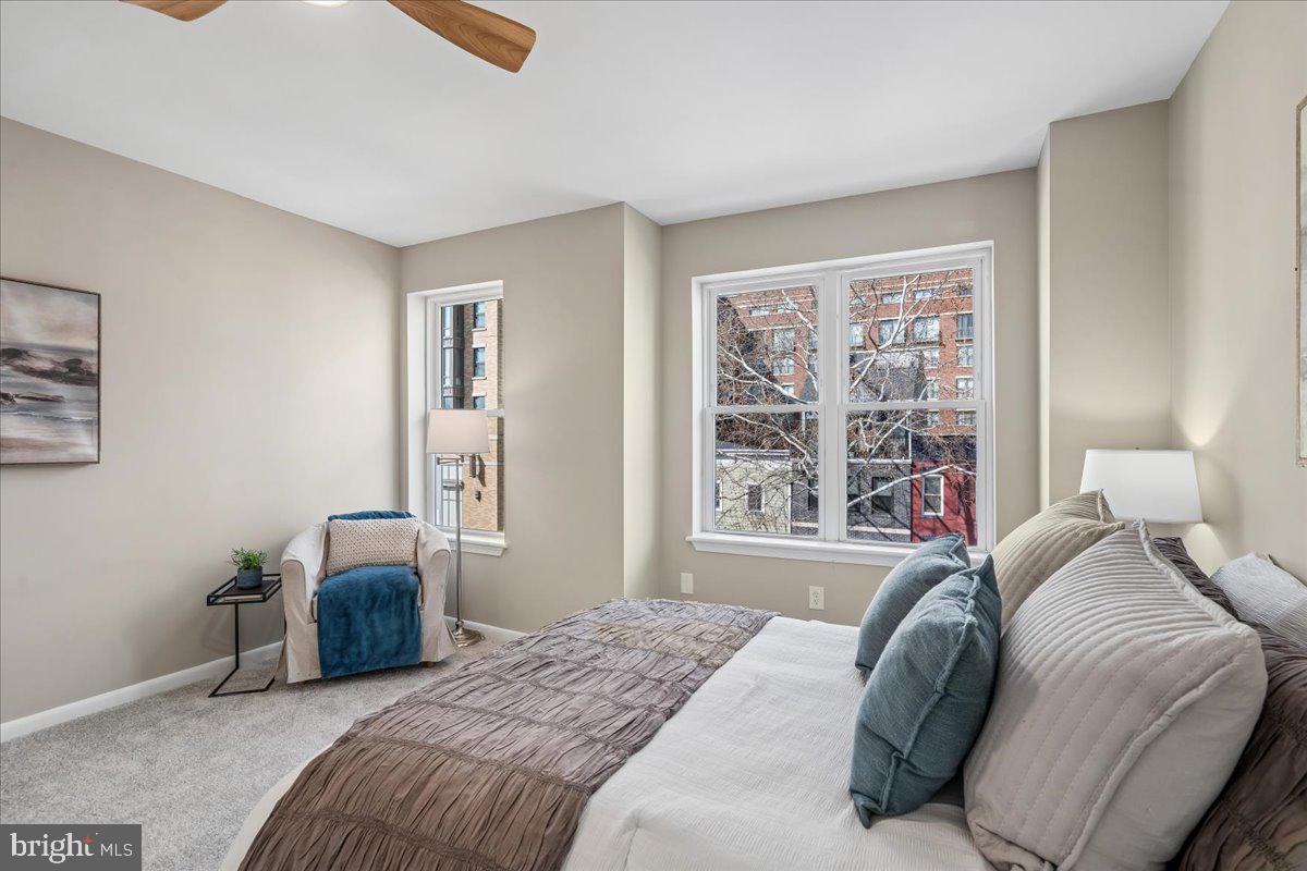 817 4th Street Northeast Washington, DC 20002 - Photo 27 of 40 a bedroom with a bed and a large window