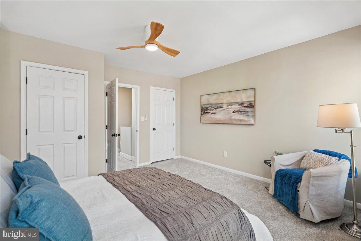 817 4th Street Northeast Washington, DC 20002 - Photo 28 of 40 a bedroom with a bed and a lamp